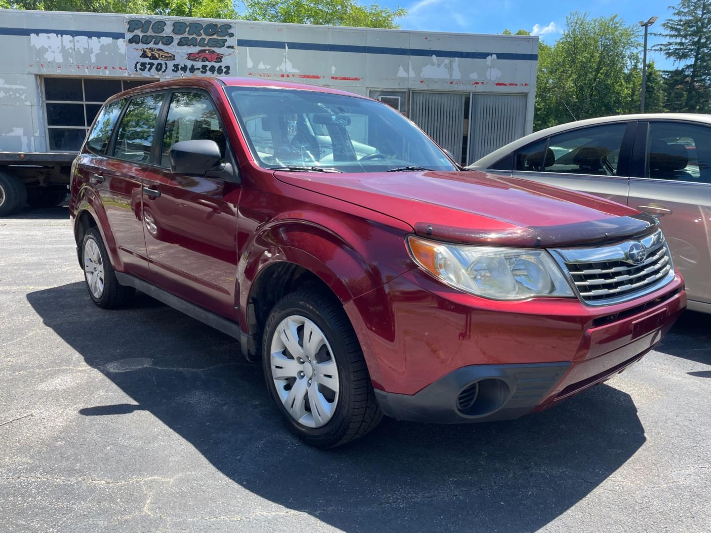 2009 Red Subaru Forester 2.5X (JF2SH61689H) with an 2.5L H4 SOHC 16V engine, 4-Speed Automatic Overdrive transmission, located at 101 N. Main Street, Muncy, PA, 17756, (570) 546-5462, 41.207691, -76.785942 - Photo#0